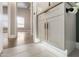 Bathroom vanity with modern hardware, under-cabinet lighting, and view into a neutrally decorated room at 1672 W Butler Dr, Chandler, AZ 85224