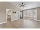 Spacious bedroom with a ceiling fan, ensuite bathroom with sliding barn door and walk-in closet at 1672 W Butler Dr, Chandler, AZ 85224
