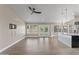 Spacious living area with durable floors, neutral paint, modern lighting, and an open layout with views into the kitchen at 1672 W Butler Dr, Chandler, AZ 85224