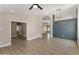 Bright and airy living room featuring wood-look flooring, neutral walls, and modern light fixtures, offering a spacious feel at 1672 W Butler Dr, Chandler, AZ 85224