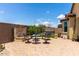 Wonderful backyard patio features brick pavers, outdoor seating area and green space at 16756 S 181St Ln, Goodyear, AZ 85338