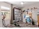 Versatile room with exercise equipment, study area, closet organizer, and a neutral color scheme at 16756 S 181St Ln, Goodyear, AZ 85338