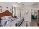 Serene bedroom with a bed and a view to an adjacent bathroom, providing a private retreat at 16756 S 181St Ln, Goodyear, AZ 85338