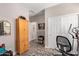 Multi-purpose room offering storage options, workout equipment, and access to other areas of the home at 16756 S 181St Ln, Goodyear, AZ 85338