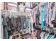 Walk-in closet offering plenty of storage space with clothing racks and shelves for shoes and accessories at 16756 S 181St Ln, Goodyear, AZ 85338