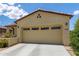 Charming home featuring desert landscaping, covered porch, and a two-car garage at 16756 S 181St Ln, Goodyear, AZ 85338