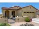 Charming home with desert landscaping, secure gated front patio, and two-car garage at 16756 S 181St Ln, Goodyear, AZ 85338