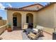 Cozy front porch featuring comfortable seating, brick pavers and covered entry at 16756 S 181St Ln, Goodyear, AZ 85338
