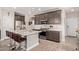 Modern kitchen with stainless steel appliances, a center island, and ample cabinet space at 16756 S 181St Ln, Goodyear, AZ 85338