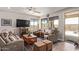 Inviting living room with ceiling fan, sliding glass door and neutral colors at 16756 S 181St Ln, Goodyear, AZ 85338