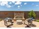 Paver patio features a stunning water feature and comfortable seating, perfect for outdoor relaxation at 16756 S 181St Ln, Goodyear, AZ 85338