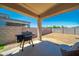Spacious covered patio and large backyard, perfect for outdoor living and entertaining at 16824 W Alice Ave, Waddell, AZ 85355