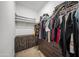 Spacious walk-in closet with custom storage, shelving and drawers to maximize your wardrobe's organization at 16824 W Alice Ave, Waddell, AZ 85355