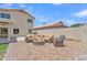 Inviting back patio with comfortable seating around a fire pit on a sunny day at 17425 N 1St Dr, Phoenix, AZ 85023