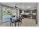 Cozy kitchen with dark cabinetry, stainless steel appliances, and a view to the yard at 17425 N 1St Dr, Phoenix, AZ 85023
