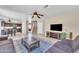 Open-concept living room with tile flooring, ceiling fans, and neutral paint at 17425 N 1St Dr, Phoenix, AZ 85023