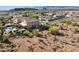 Property with scenic views, back yard pool, covered patio, desert landscape, and nearby neighborhood at 18121 E San Luis Dr, Gold Canyon, AZ 85118