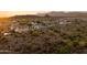 Expansive aerial view of a desert community nestled in a scenic landscape at 18121 E San Luis Dr, Gold Canyon, AZ 85118