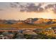 Wide aerial shot featuring desert scenery with new home construction and mountain views at 18121 E San Luis Dr, Gold Canyon, AZ 85118