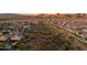 Panoramic aerial view showcasing a residential community in a natural desert landscape at 18121 E San Luis Dr, Gold Canyon, AZ 85118
