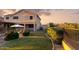 Expansive backyard features lush landscaping, iron fence, and covered patio, perfect for outdoor living at 18121 E San Luis Dr, Gold Canyon, AZ 85118