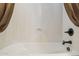 Clean white bathtub with bronze fixtures and a brown curtain at 18121 E San Luis Dr, Gold Canyon, AZ 85118