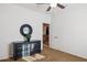 Neutral toned bedroom featuring carpet, ceiling fan, dresser, and black framed mirror at 18121 E San Luis Dr, Gold Canyon, AZ 85118