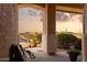 Relaxing front porch offers tranquil desert and mountain views at 18121 E San Luis Dr, Gold Canyon, AZ 85118