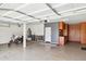 Organized garage space featuring a motorcycle, cabinets, and workspace at 18121 E San Luis Dr, Gold Canyon, AZ 85118