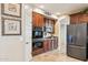 Well-equipped kitchen with stainless steel appliances, tiled flooring and wooden cabinetry at 18121 E San Luis Dr, Gold Canyon, AZ 85118
