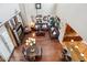 Open-concept living room featuring hardwood floors, high ceilings, and a leather furniture set at 18121 E San Luis Dr, Gold Canyon, AZ 85118