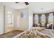 Main bedroom featuring a window view, ceiling fan, and sitting area at 18121 E San Luis Dr, Gold Canyon, AZ 85118