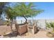 Outdoor grilling station with a built-in grill and prep area in a landscaped backyard at 19182 N Smith Dr, Maricopa, AZ 85139