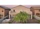 Backyard view with a spa, patio, greenery, and a second-story balcony at 19182 N Smith Dr, Maricopa, AZ 85139