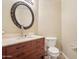 Powder room featuring a pedestal sink, decorative mirror, and neutral wall color at 19182 N Smith Dr, Maricopa, AZ 85139