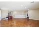 Large, bright living room with hardwood floors, a neutral color palette, and ample open space at 19182 N Smith Dr, Maricopa, AZ 85139
