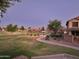 Community park features playground equipment, trees, and walking paths at 19182 N Smith Dr, Maricopa, AZ 85139