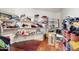 Walk-in closet with shelving, hardwood floors, and ample storage at 19182 N Smith Dr, Maricopa, AZ 85139