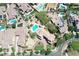 Aerial view of home featuring lush landscaping, pool/spa, putting green, and charming desert aesthetics at 20409 W Thayer St, Buckeye, AZ 85396