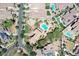 An aerial view shows a property with a pool surrounded by desert landscaping in a residential area at 20409 W Thayer St, Buckeye, AZ 85396
