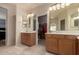 Spacious dual vanity bathroom with view to walk-in closet at 20409 W Thayer St, Buckeye, AZ 85396