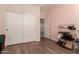 Bedroom featuring an interior door and a closet with sliding doors at 20409 W Thayer St, Buckeye, AZ 85396