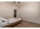 Bedroom featuring natural light, door to closet, and modern ceiling fan at 20409 W Thayer St, Buckeye, AZ 85396