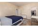 Bedroom featuring hardwood floors and open closet door at 20409 W Thayer St, Buckeye, AZ 85396