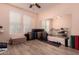 Spare bedroom featuring a window with blinds and a large mirror at 20409 W Thayer St, Buckeye, AZ 85396