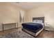Comfortable bedroom with plush rug, stylish bed, and ample natural light, creating a relaxing atmosphere at 20409 W Thayer St, Buckeye, AZ 85396