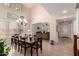 Bright and airy dining room with a view into the living area and high ceilings at 20409 W Thayer St, Buckeye, AZ 85396