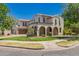 Beautiful two-story home featuring a well-kept lawn, mature landscaping, and arched entryways, blending style and curb appeal at 20409 W Thayer St, Buckeye, AZ 85396
