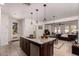 Spacious kitchen island offering generous counter space and a view to the living room at 20409 W Thayer St, Buckeye, AZ 85396