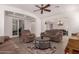 Inviting living room featuring comfortable seating, wood-look floors, and an open layout, perfect for relaxation and entertaining at 20409 W Thayer St, Buckeye, AZ 85396